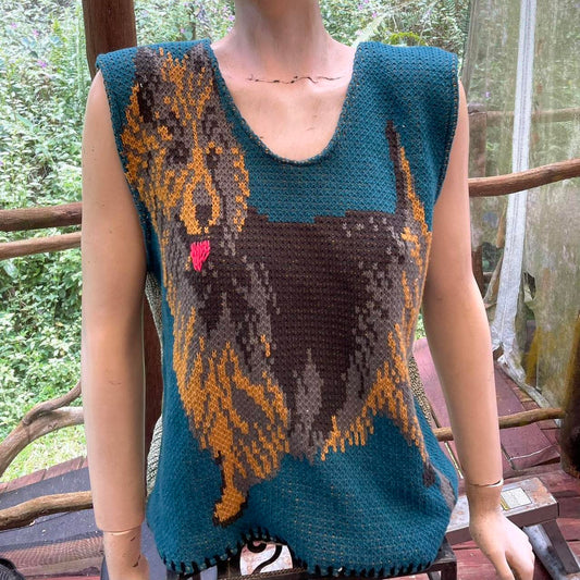A mannequin wearing a sweater with a dog on it.
