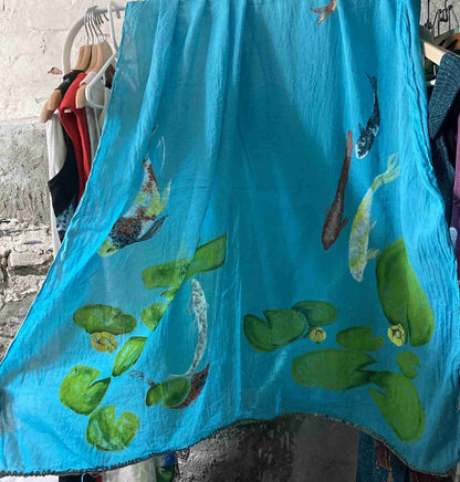 there is a blue towel with fish on it.