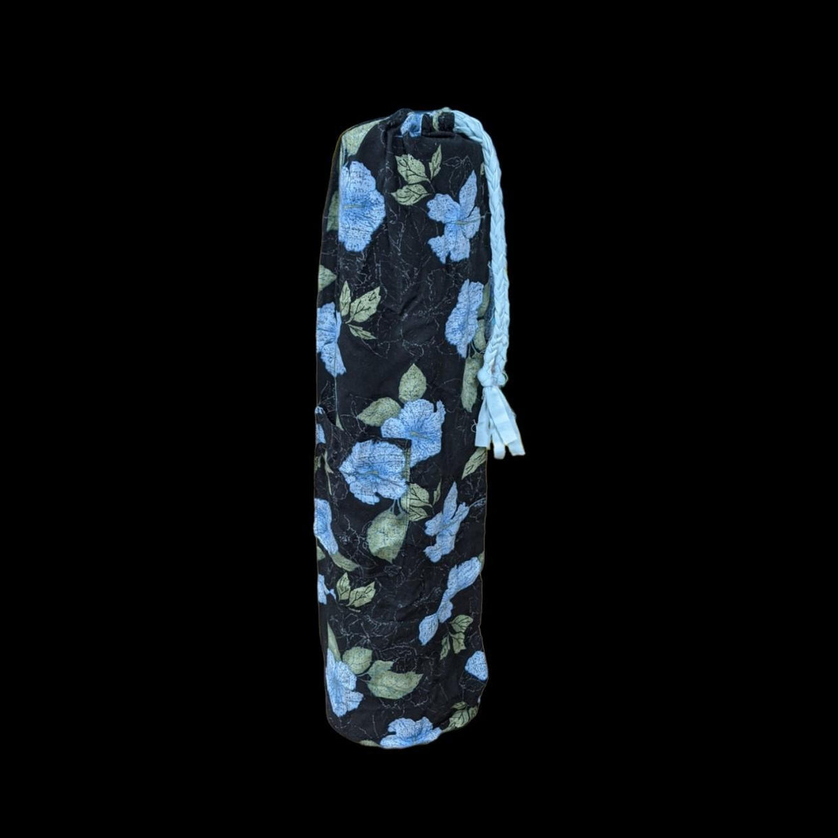 A blue floral yoga bag on a black background.