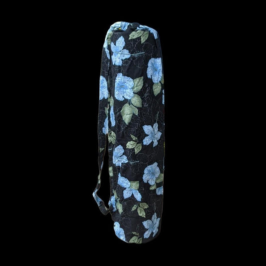 A black yoga bag with blue flowers on it.