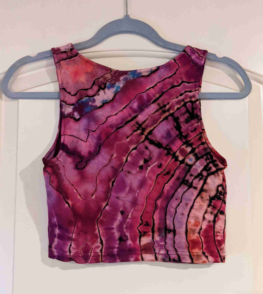 a tank top hanging on a hanger.