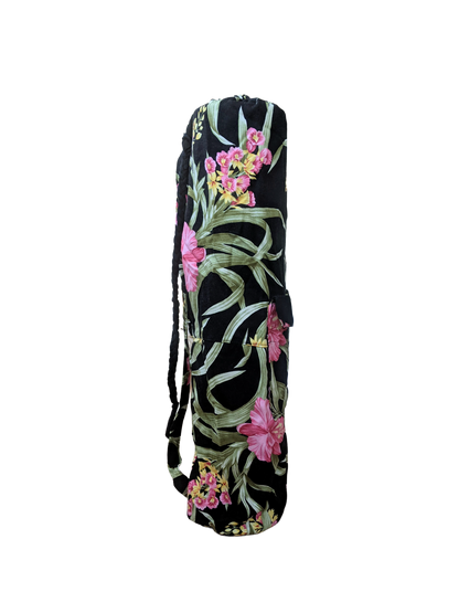 A black yoga bag with pink flowers on it.