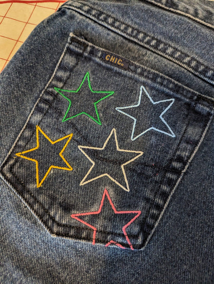 Rainbow Star Jeans with rainbow colored stars on them.