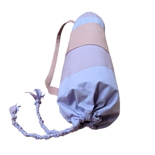 A yoga bag with a pink and blue stripe on it.