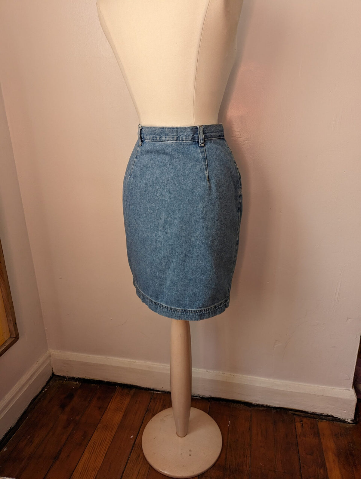 A white mannequin wearing a Reworked Embroidered Heart Skirt.