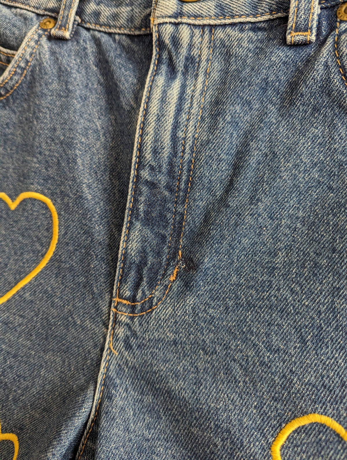 A pair of Embroidered Heart Shorts.