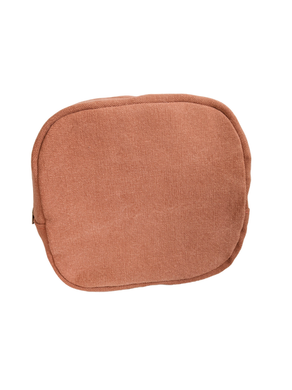 A small orange pouch on a black background.