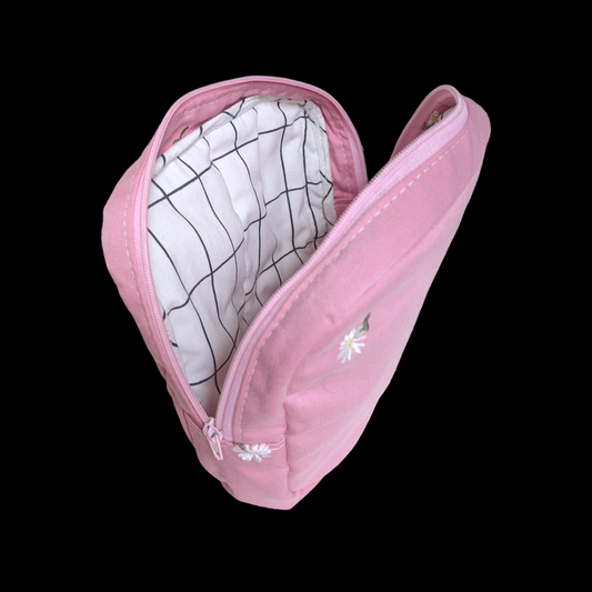 A pink cosmetic bag with a zipper.