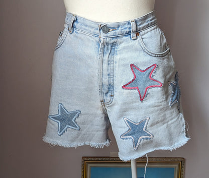 a white mannequin wearing a pair of shorts with stars on them.
