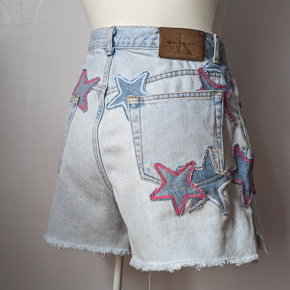a mannequin wearing a pair of shorts with stars on them.