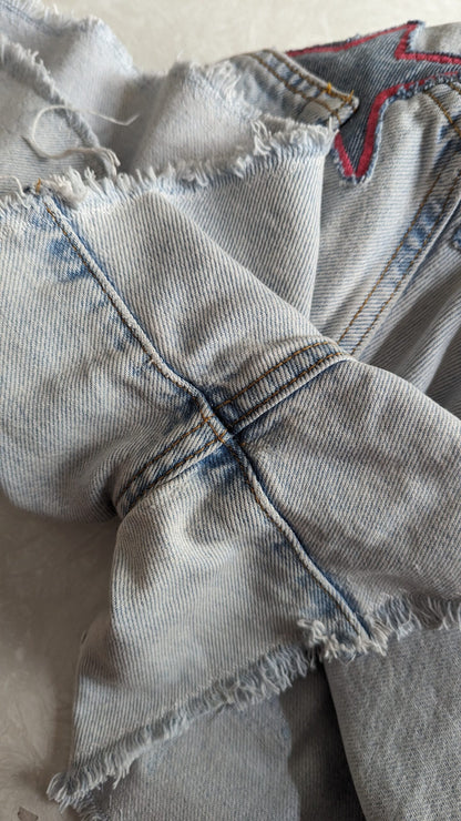 a close up of a pair of ripped jeans.