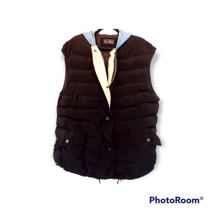 a black vest with a white shirt underneath it.