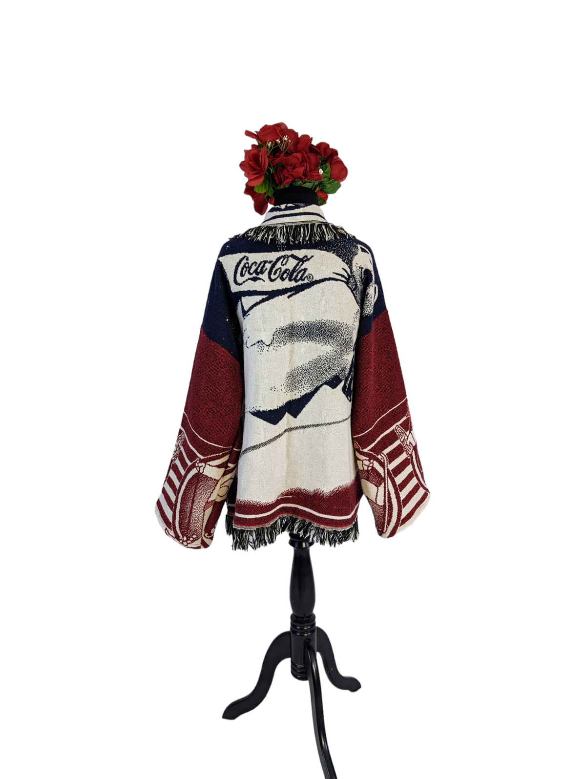 a sweater with a flower on top of it.