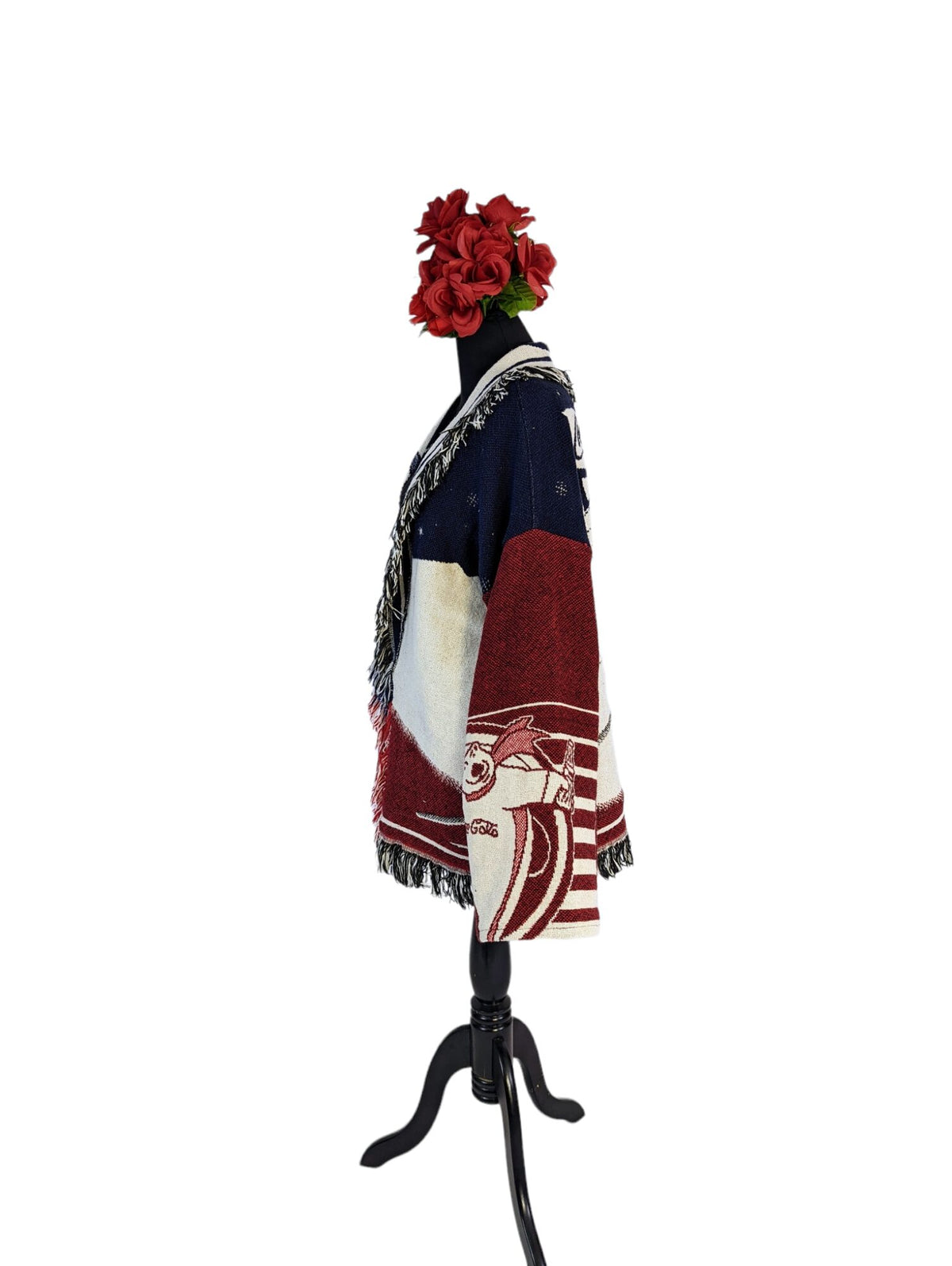 a mannequin with a red flower in it's hair.