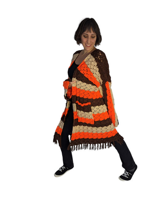 Side view of woman wearing 70's men's crochet cardigan.