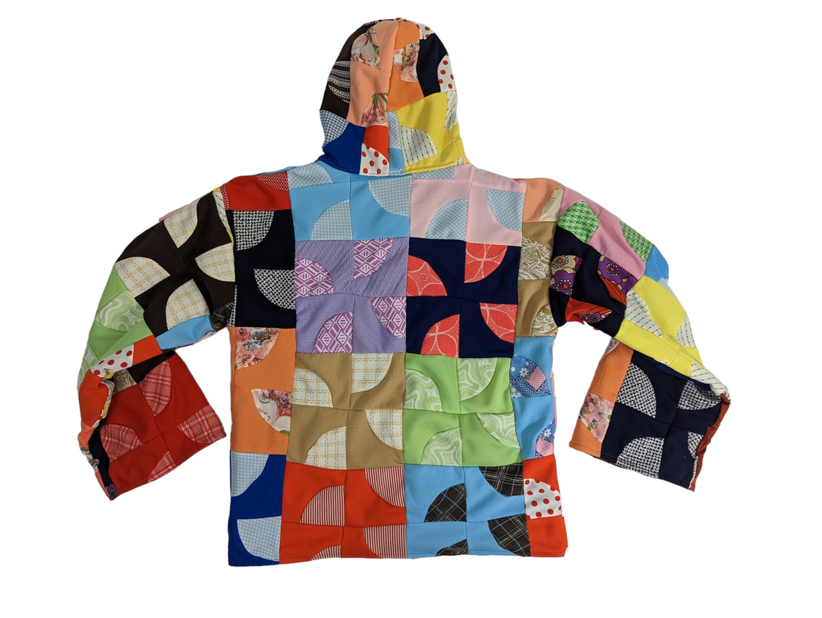 Top view of back side of men's patchwork quilt coat.