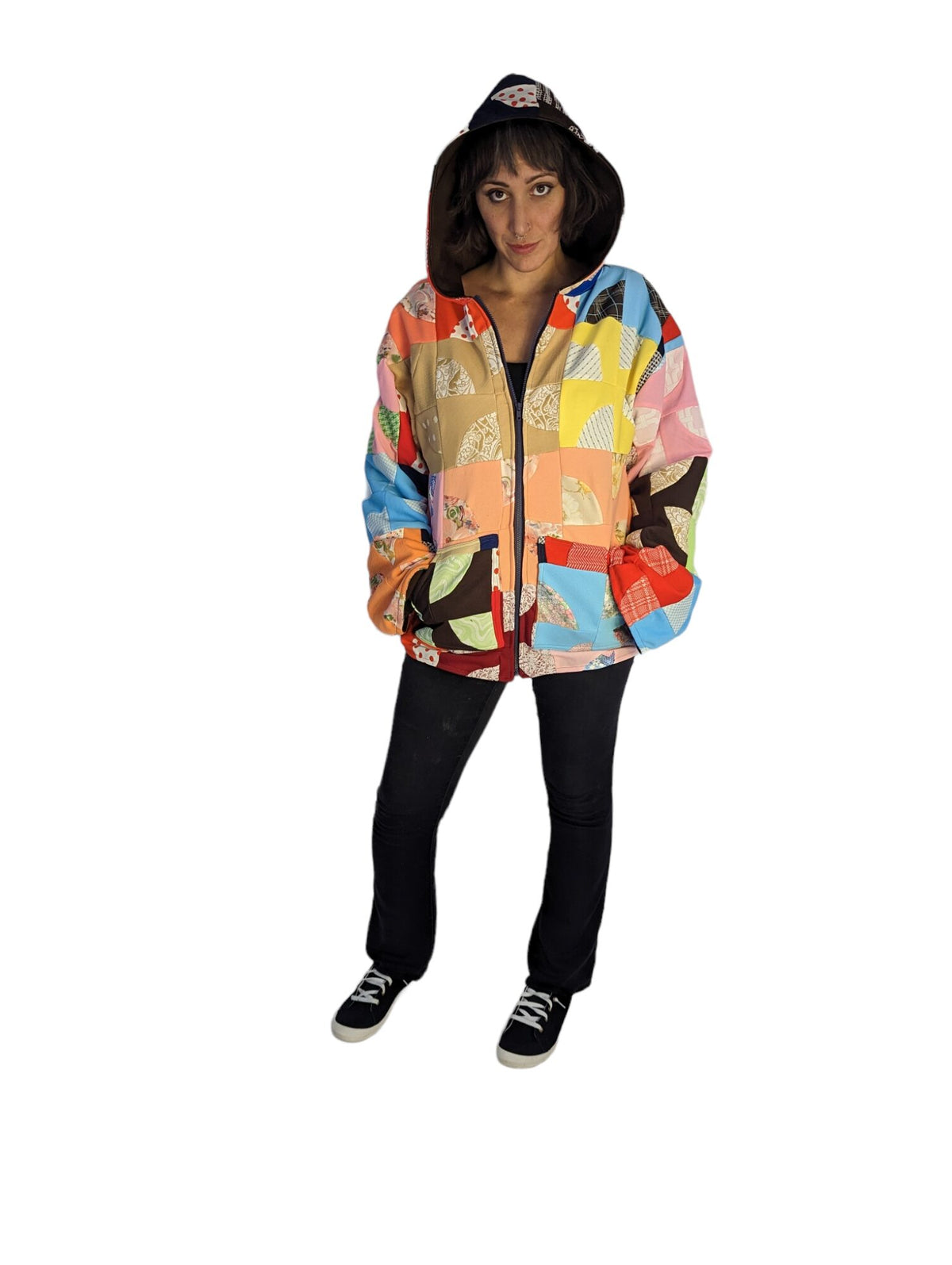 Front view of model wearing patchwork quilt coat