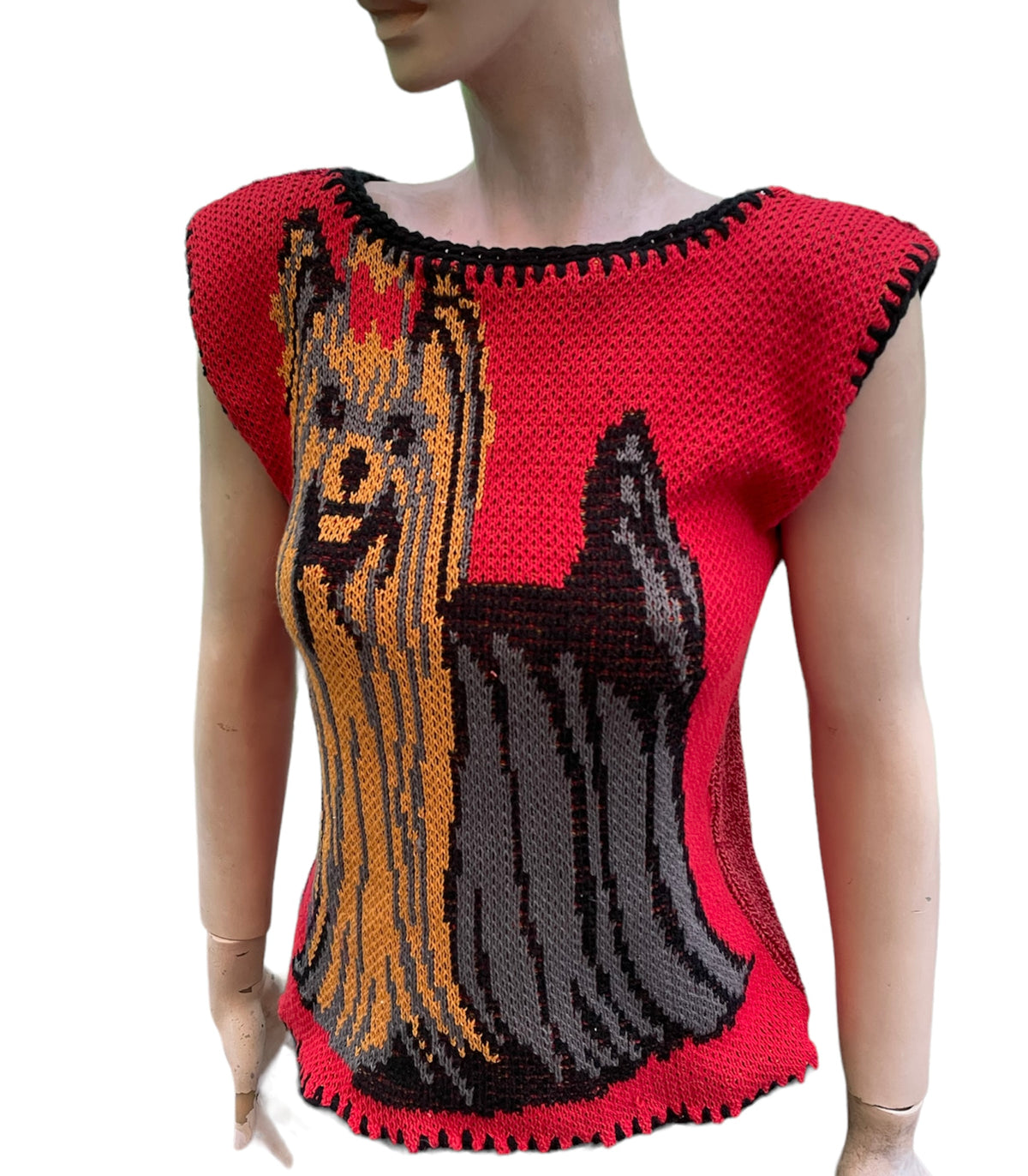 a mannequin wearing a knitted dog sweater.
