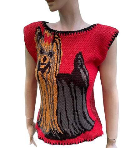 a mannequin wearing a knitted dog sweater.