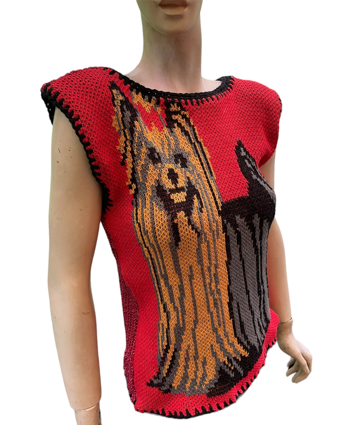 a mannequin wearing a knitted dog sweater.
