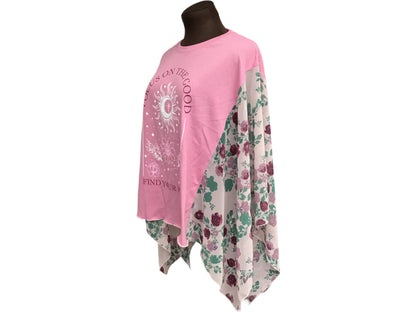 A mannequin wearing a pink t - shirt with flowers on it.