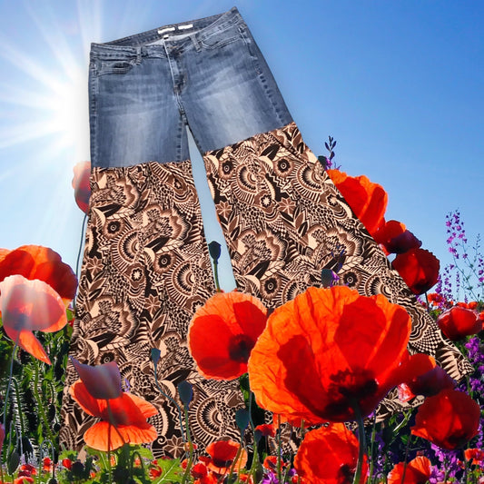 A pair of jeans with flowers on them.