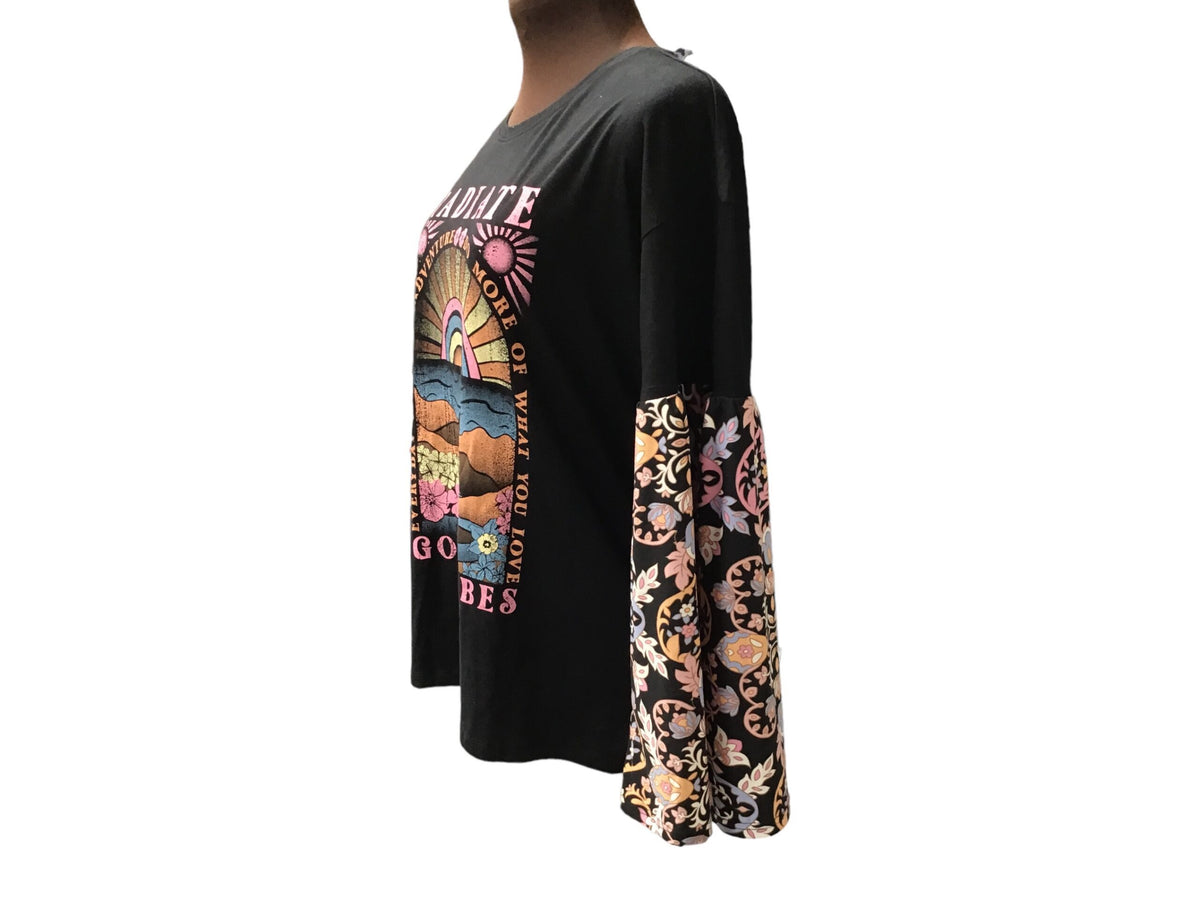 A black t - shirt with an image of a woman wearing a t - shirt.