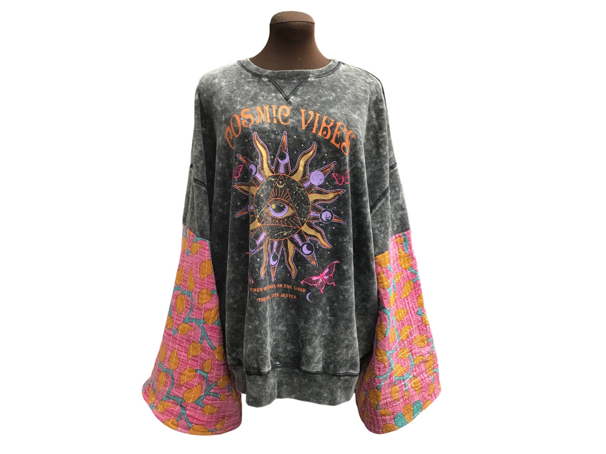 A long - sleeved shirt with an sun moon and stars