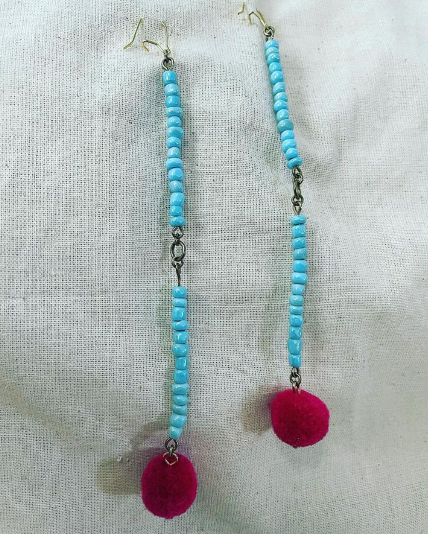 a pair of blue and red beaded earrings.