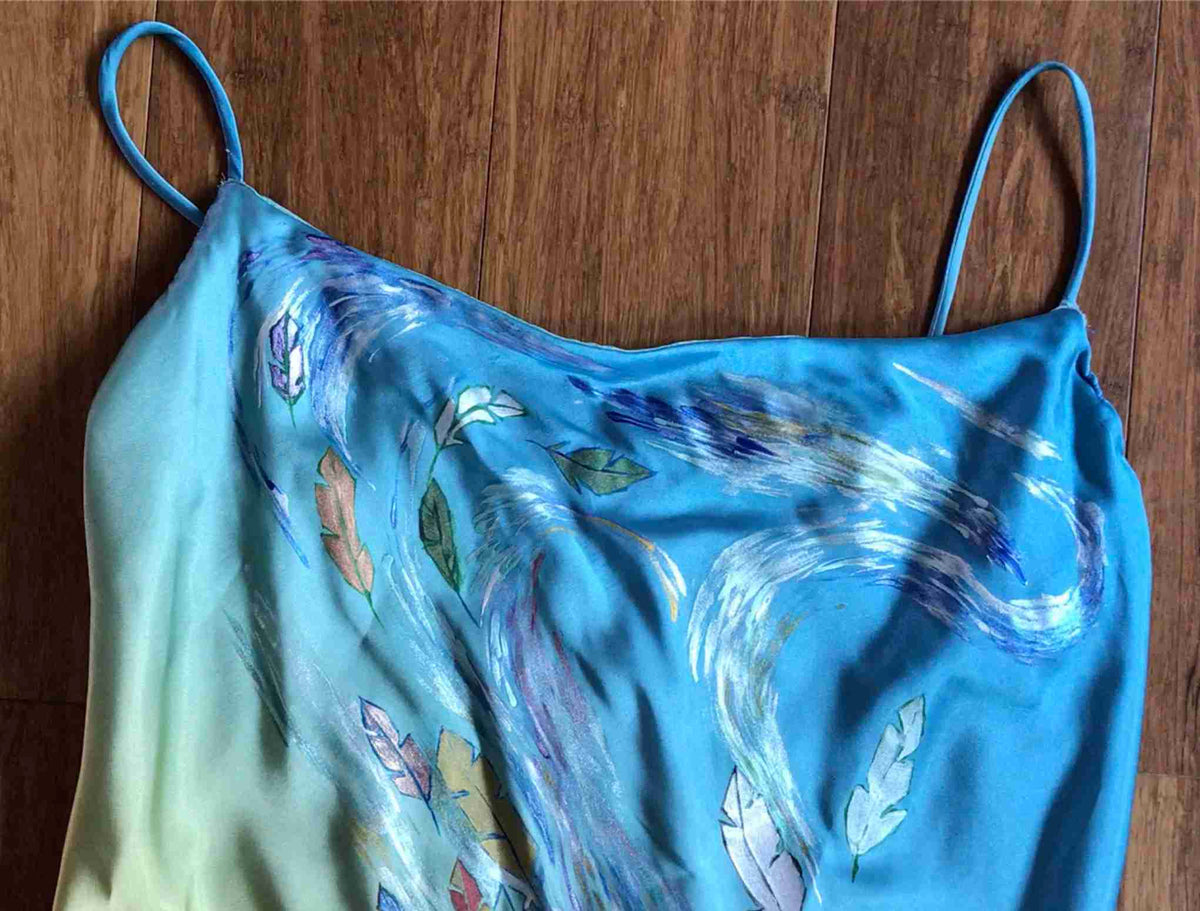 a blue top with a design on it.