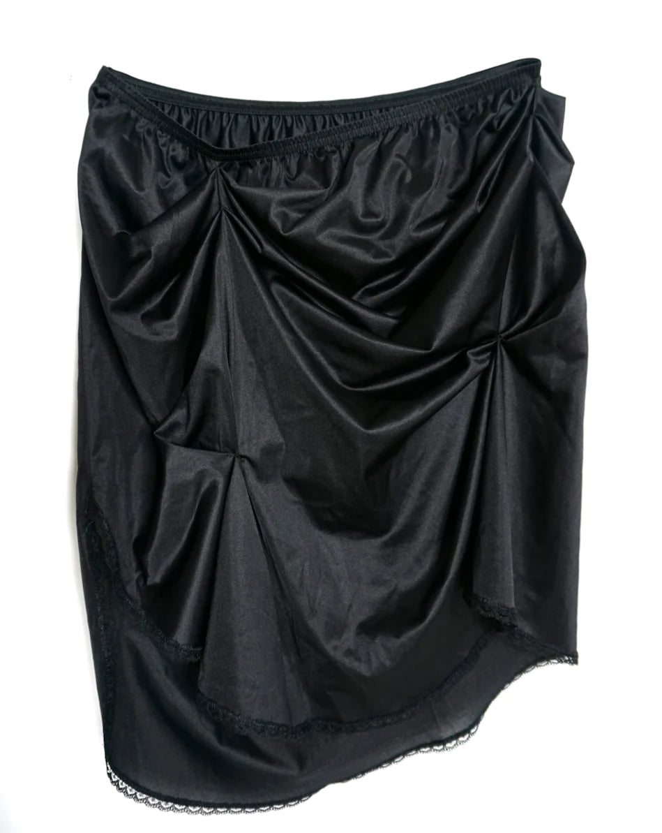 A women's LACE ICING Black Mini Skirt with ruffles on the bottom.