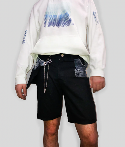 a man wearing a white sweatshirt and Bull Denim Up-worked Shorts in black.