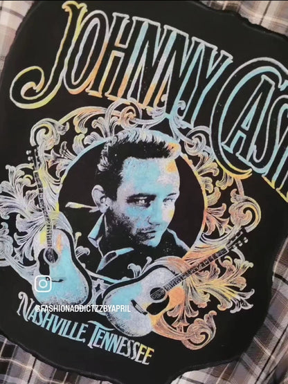 a black jacket with a picture of a man holding a guitar.