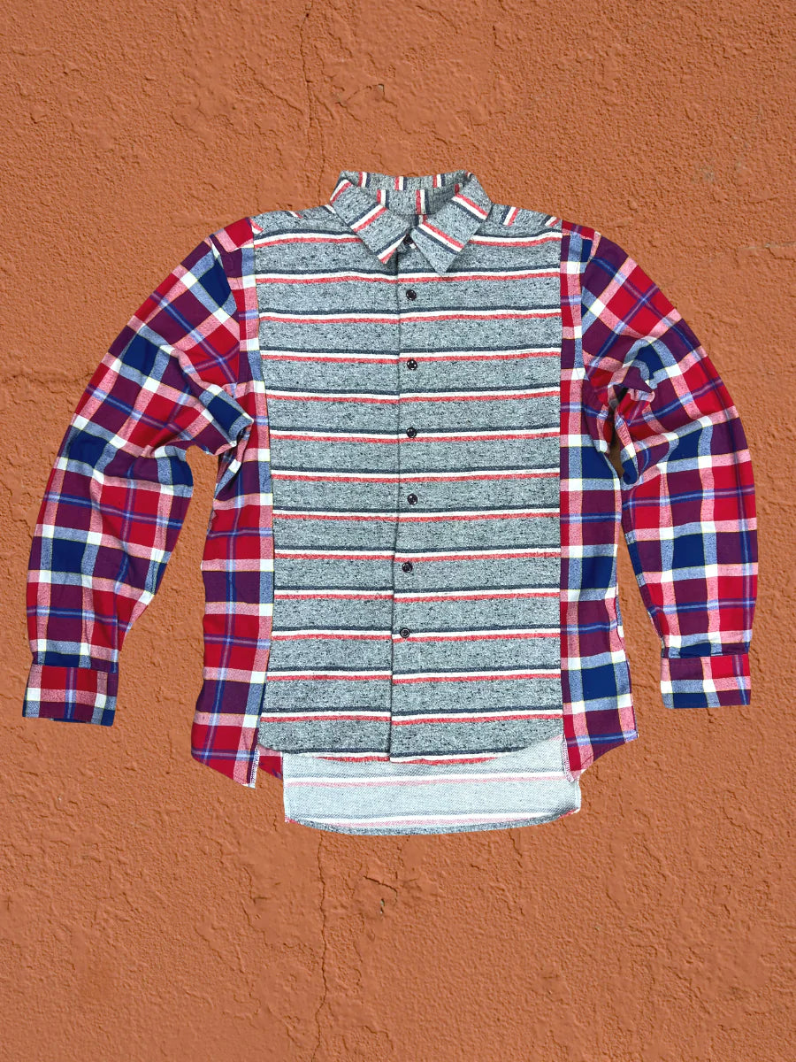 a red, white and blue shirt hanging on a wall.