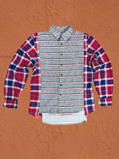 a red, white and blue shirt hanging on a wall.
