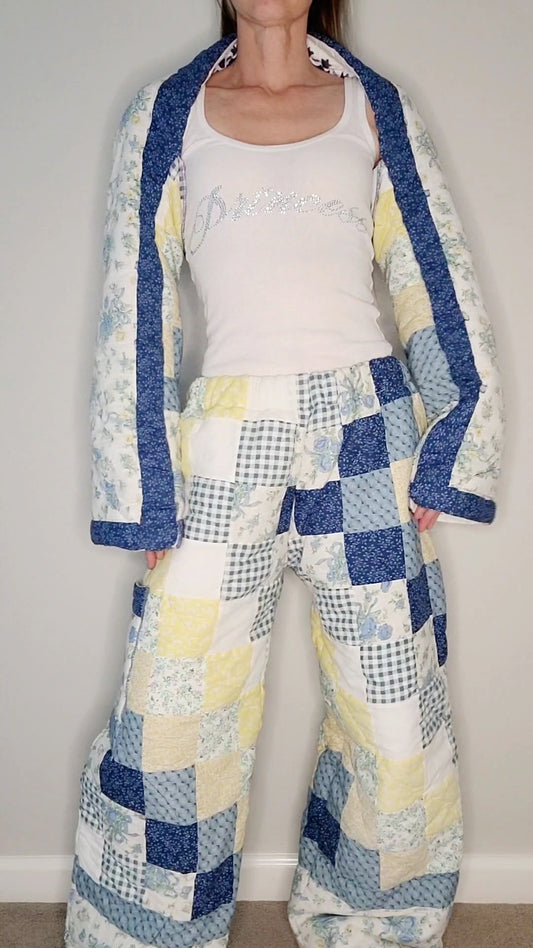 A woman wearing a blue and yellow quilted pajama set.