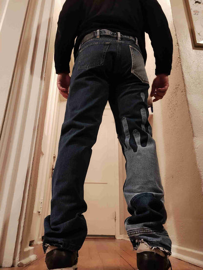 a man standing on a wooden floor in a hallway.