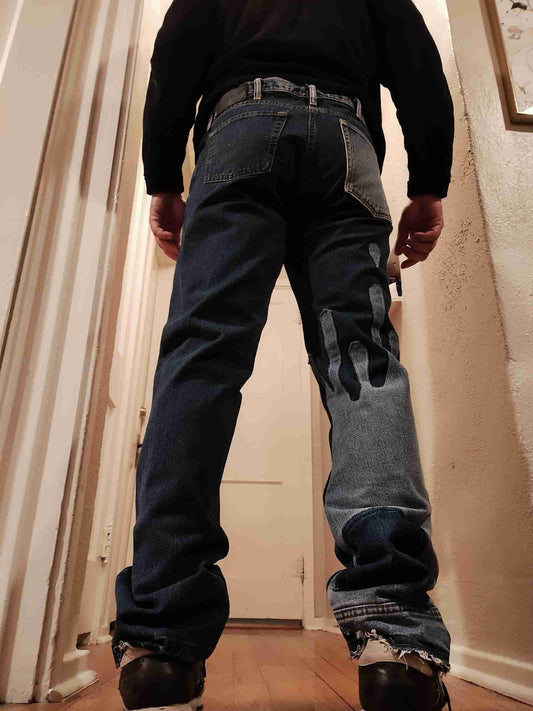 a man standing on a wooden floor in a hallway.