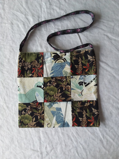 A bag with a patchwork pattern on it.