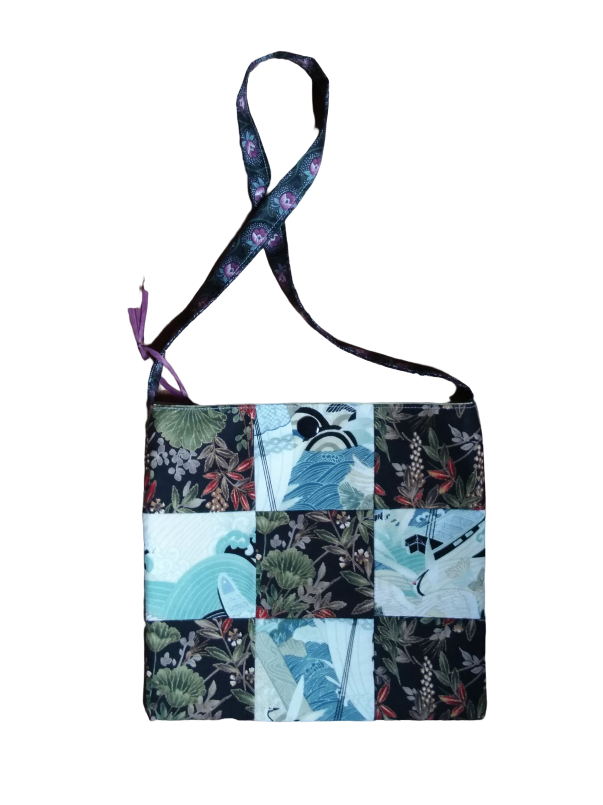 A patchwork bag with flowers and birds on it