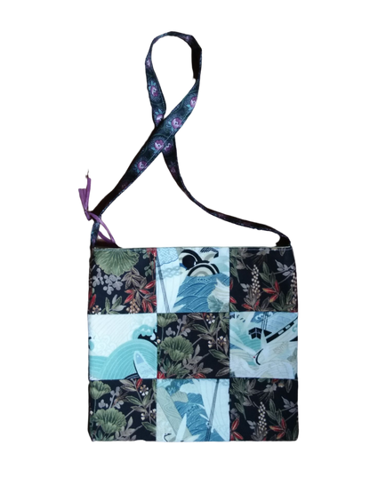 A patchwork bag with flowers and birds on it