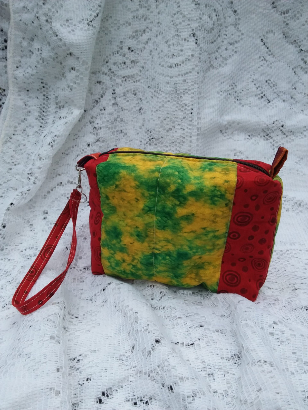 Retro Artsy wristlet handbag with key chain strap in bold red and funky batik