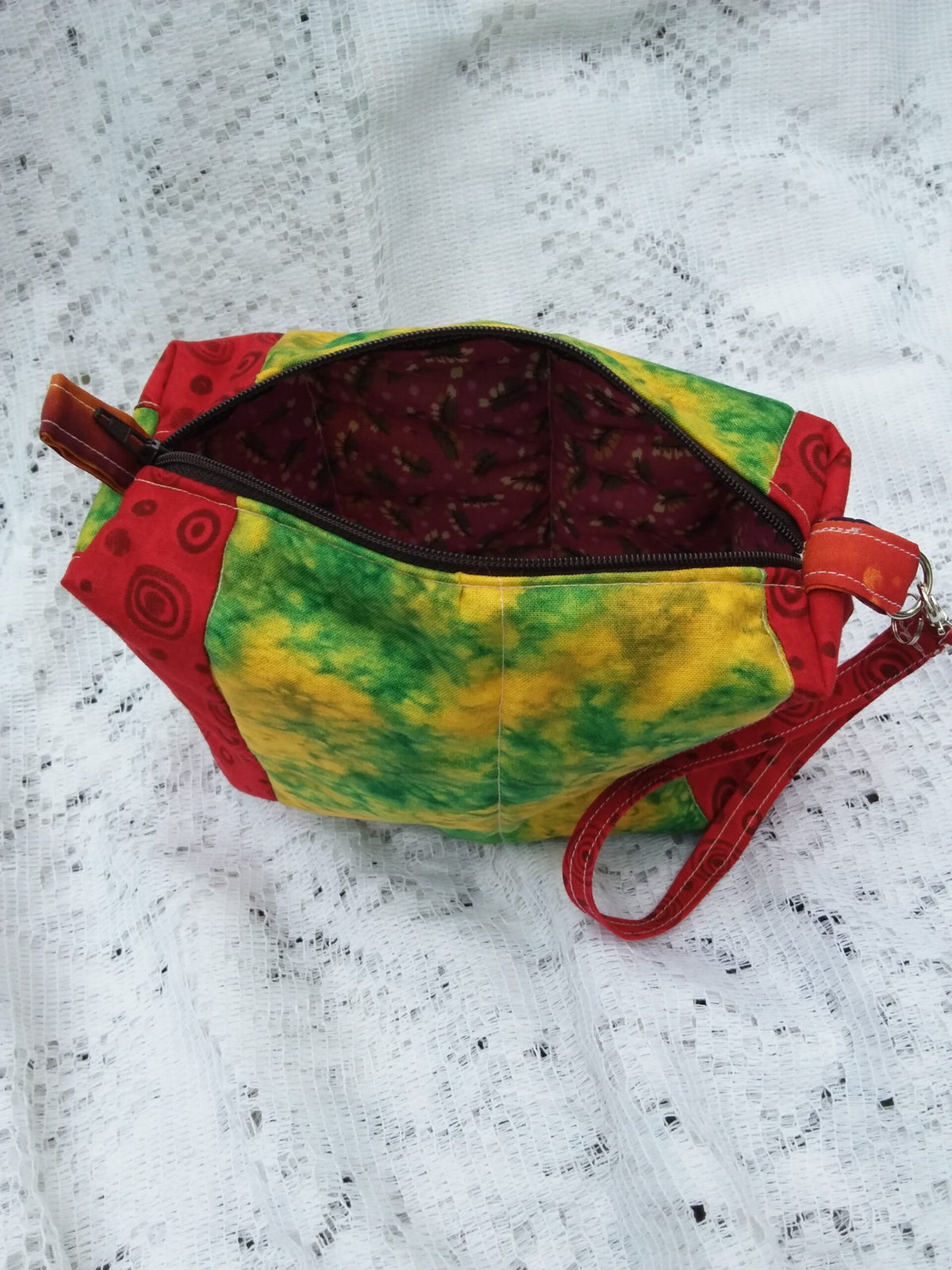 Retro Artsy wristlet handbag with key chain strap in bold red and funky batik