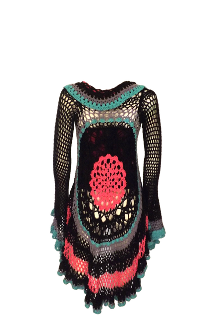 A black and pink crocheted duster coat on a mannequin.