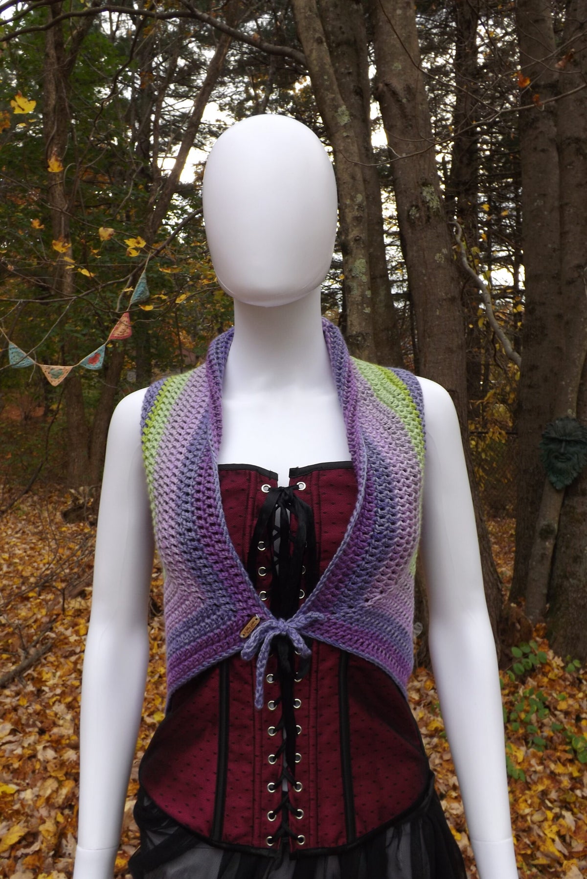 A crochet top with tie front over a corset