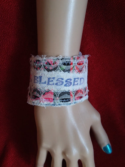 A mannequin wearing a bracelet that says blessed.