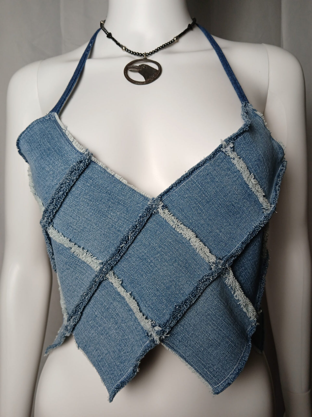 Upcycled raw edge denim halter and a raven necklace