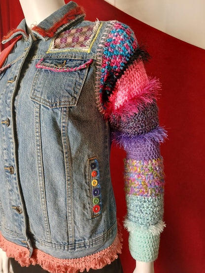 A colorful crochet and denim jacket with applique patches and embroidery