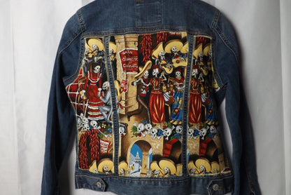 A denim jacket with calavera skeleton fabric quilted on it