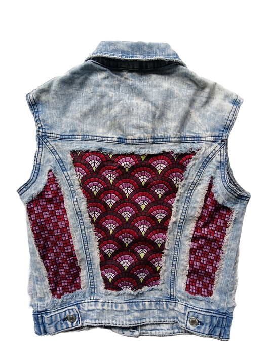 A raw denim upcycled vest with art deco fabric panels